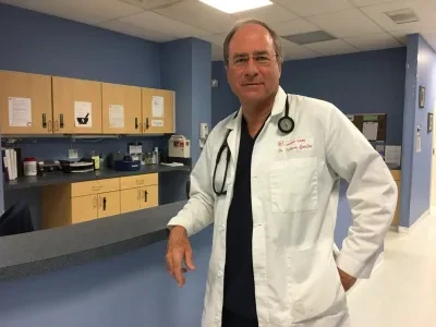 Physician in clinical setting — Dr. Andrew Goodman